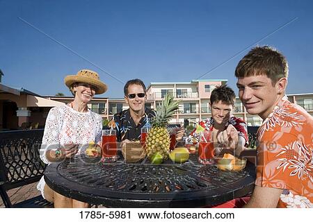 Portrait of a family enjoying tropical vacation View Large Photo Image Stock Image - Portrait of a family enjoying tropical vacation. Fotosearch
