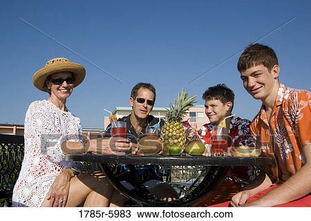 Portrait of a family enjoying tropical vacation View Large Photo Image Stock Image - Portrait of a family enjoying tropical vacation. Fotosearch