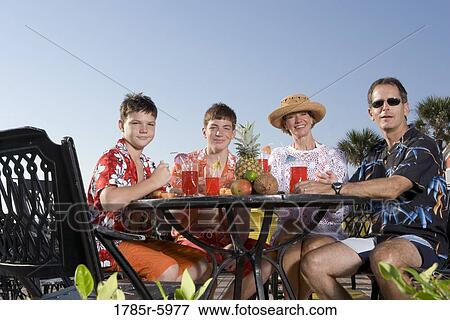Portrait of a family enjoying tropical vacation View Large Photo Image Stock Photo - Portrait of a family enjoying tropical vacation. Fotosearch