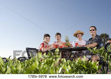 Portrait of a family enjoying tropical vacation View Large Photo Image Stock Photo - Portrait of a family enjoying tropical vacation. Fotosearch