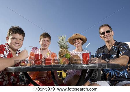 Portrait of a family enjoying tropical vacation View Large Photo Image Stock Photo - Portrait of a family enjoying tropical vacation. Fotosearch