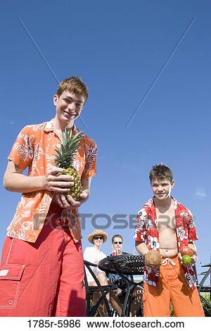 Portrait of a family enjoying tropical vacation View Large Photo Image Stock Photograph - Portrait of a family enjoying tropical vacation. Fotosearch