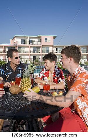 Portrait of a family enjoying tropical vacation View Large Photo Image Stock Photography - Portrait of a family enjoying tropical vacation. Fotosearch