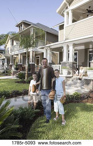 Portrait of a family in front of their house View Large Photo Image Stock Image - Portrait of a family in front of their house. Fotosearch