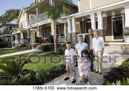 Portrait of a family in front of their house View Large Photo Image Stock Image - Portrait of a family in front of their house. Fotosearch