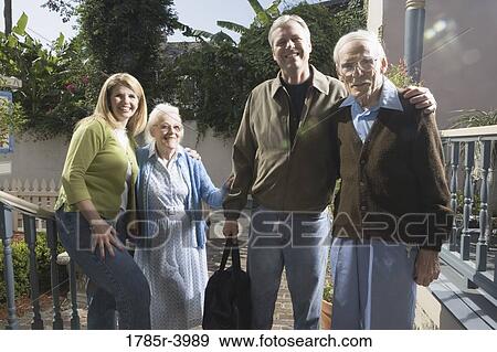Portrait of a family with senior parents and adult children on front steps of house View Large Photo Image Stock Photo - Portrait of a family with senior parents and adult children on front steps of house. Fotosearch