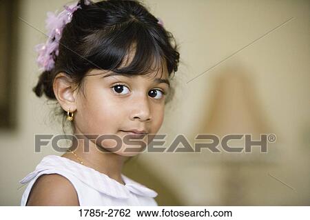 Portrait of a young girl View Large Photo Image Stock Image - Portrait of a young girl. Fotosearch