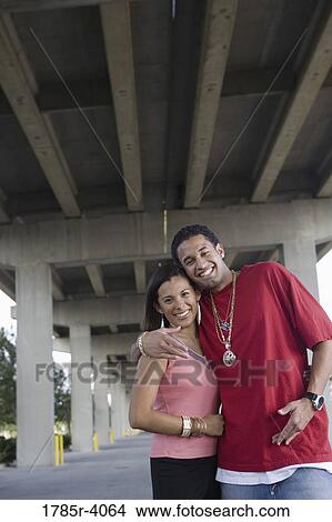 Portrait of a young hip-hop couple under highway overpass View Large Photo Image Picture - Portrait of a young hip-hop couple under highway overpass. Fotosearch