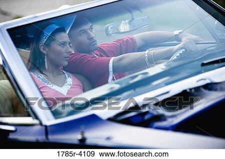 Portrait of a young hip-hop couple sitting in a pimped-up vintage car View Large Photo Image Stock Photo - Portrait of a young hip-hop couple sitting in a pimped-up vintage car. Fotosearch