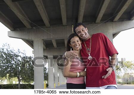 Portrait of a young hip-hop couple under highway overpass View Large Photo Image Stock Photography - Portrait of a young hip-hop couple under highway overpass. Fotosearch