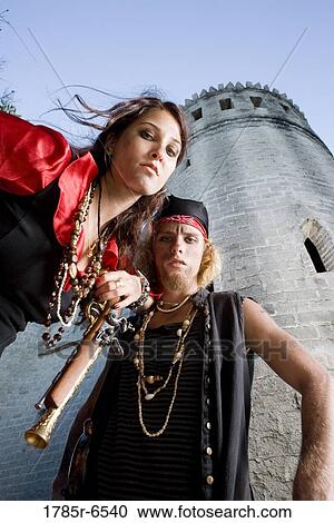 Portrait of armed pirates standing outside a castle View Large Photo Image Stock Image - Portrait of armed pirates standing outside a castle. Fotosearch