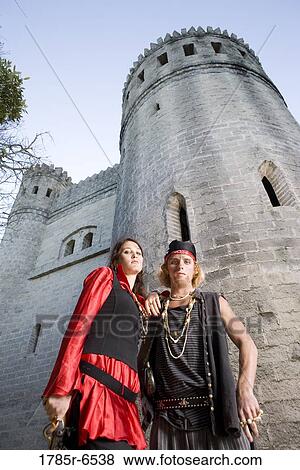Portrait of armed pirates standing outside a castle View Large Photo Image Stock Photo - Portrait of armed pirates standing outside a castle. Fotosearch