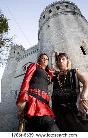 Portrait of armed pirates standing outside a castle View Large Photo Image Stock Photo - Portrait of armed pirates standing outside a castle. Fotosearch