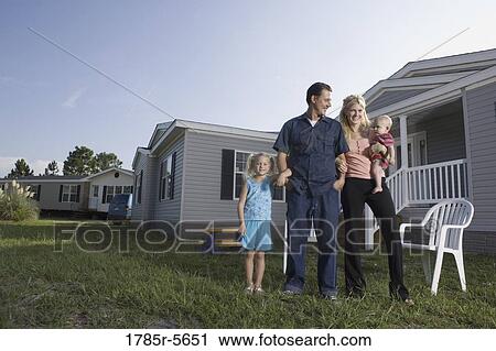 Portrait of blue-collar family in front of a trailer home View Large Photo Image Stock Image - Portrait of blue-collar family in front of a trailer home. Fotosearch