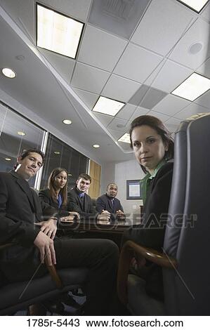 Stock Image - Portrait of business executives in a formal conference room. Fotosearch