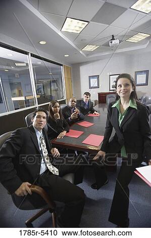 Portrait of business men and women in a formal conference room View Large Photo Image Stock Image - Portrait of business men and women in a formal conference room. Fotosearch