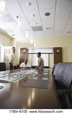 Portrait of business people in a conference room View Large Photo Image Stock Image - Portrait of business people in a conference room. Fotosearch