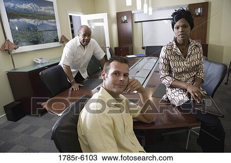 Portrait of business people in a conference room View Large Photo Image Stock Image - Portrait of business people in a conference room. Fotosearch