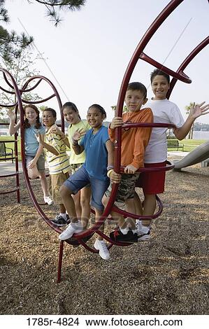 Portrait of children climbing on monkey bars at a playground View Large Photo Image Picture - Portrait of children climbing on monkey bars at a playground. Fotosearch