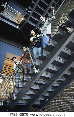Portrait of college students standing on staircase View Large Photo Image Stock Image - Portrait of college students standing on staircase. Fotosearch