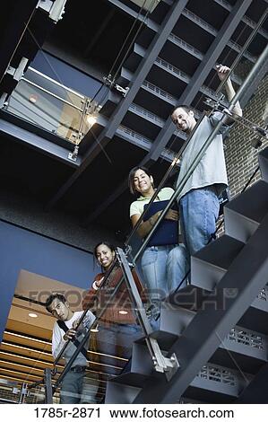 Portrait of college students standing on staircase View Large Photo Image Stock Image - Portrait of college students standing on staircase. Fotosearch
