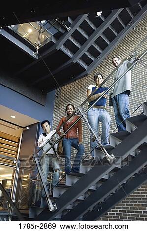 Portrait of college students standing on staircase View Large Photo Image Stock Photo - Portrait of college students standing on staircase. Fotosearch