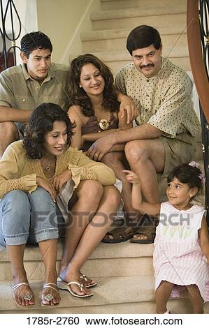 Portrait of family sitting together on stairs View Large Photo Image Stock Image - Portrait of family sitting together on stairs. Fotosearch