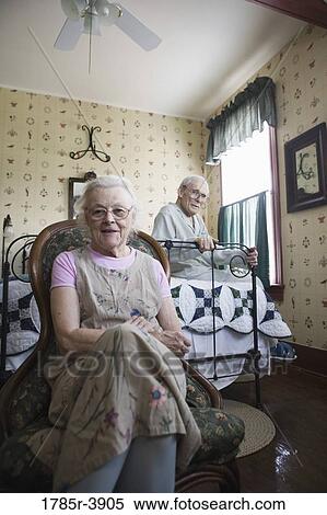 Portrait of feeble senior couple sitting in bedroom View Large Photo Image Stock Photography - Portrait of feeble senior couple sitting in bedroom. Fotosearch