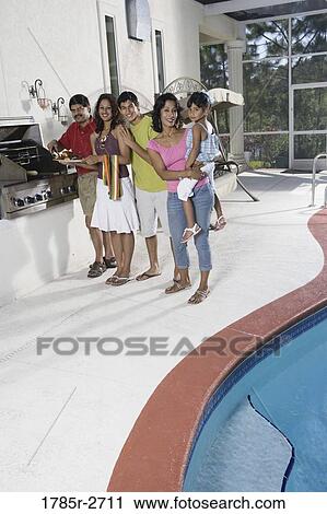 Portrait of Indian family on a patio by an outdoor kitchen View Large Photo Image Stock Image - Portrait of Indian family on a patio by an outdoor kitchen. Fotosearch