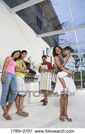 Portrait of Indian family on a patio by an outdoor kitchen View Large Photo Image Stock Photo - Portrait of Indian family on a patio by an outdoor kitchen. Fotosearch