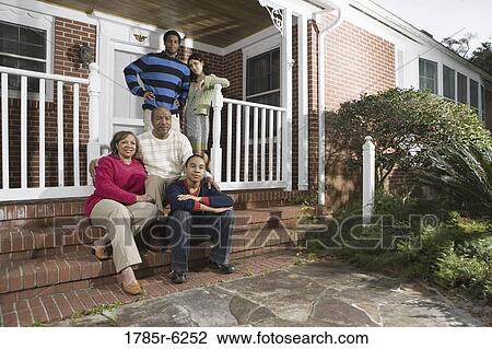 Portrait of interracial couple and family in front of house View Large Photo Image Stock Image - Portrait of interracial couple and family in front of house. Fotosearch