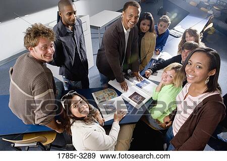 Stock Photo - Portrait of students and teacher in the classroom. Fotosearch
