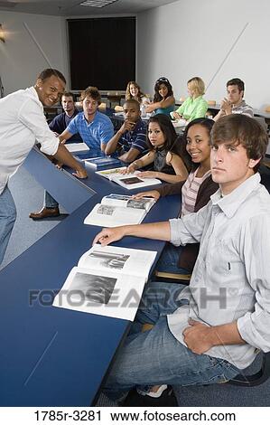 Portrait of Teacher and students in the classroom View Large Photo Image Stock Image - Portrait of Teacher and students in the classroom. Fotosearch