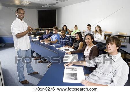 Portrait of Teacher and students in the classroom View Large Photo Image Stock Photograph - Portrait of Teacher and students in the classroom. Fotosearch