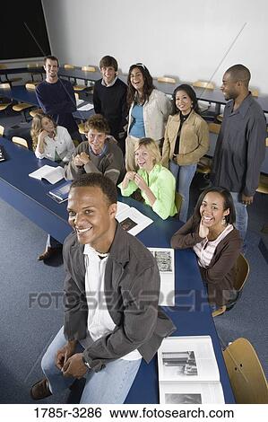 Portrait of Teacher and students in the classroom View Large Photo Image Stock Photograph - Portrait of Teacher and students in the classroom. Fotosearch