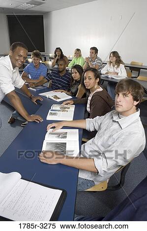Portrait of Teacher and students in the classroom View Large Photo Image Stock Photography - Portrait of Teacher and students in the classroom. Fotosearch