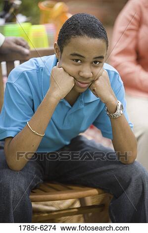 Portrait of teenage boy smiling View Large Photo Image Picture - Portrait of teenage boy smiling. Fotosearch