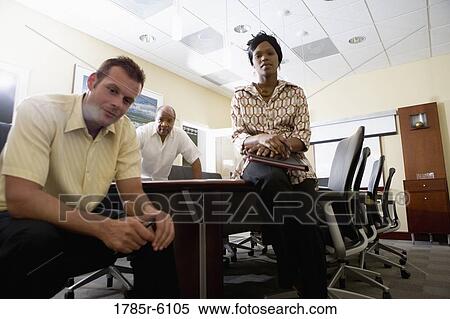 Portrait of three business people in a conference room View Large Photo Image Stock Photography - Portrait of three business people in a conference room. Fotosearch