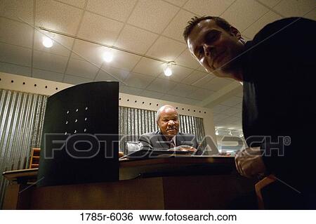 Portrait of two businesmen in an office View Large Photo Image Stock Photograph - Portrait of two businesmen in an office. Fotosearch