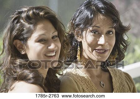 Stock Image - Portrait of two women smiling. Fotosearch