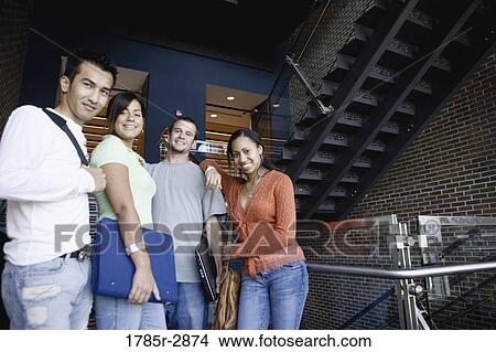 Picture - Portrait of university students hanging out between classes. Fotosearch
