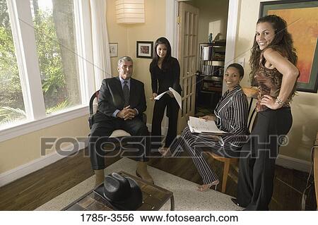 Portrait of women entrepreneurs in a business meeting View Large Photo Image Stock Photograph - Portrait of women entrepreneurs in a business meeting. Fotosearch
