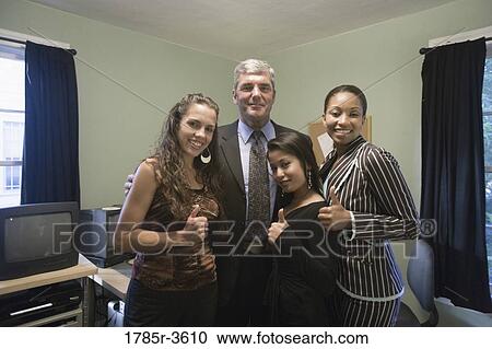 Portrait of women entrepreneurs with investor in an office View Large Photo Image Stock Image - Portrait of women entrepreneurs with investor in an office. Fotosearch