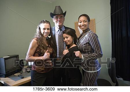 Portrait of women entrepreneurs with investor in an office View Large Photo Image Stock Photo - Portrait of women entrepreneurs with investor in an office. Fotosearch