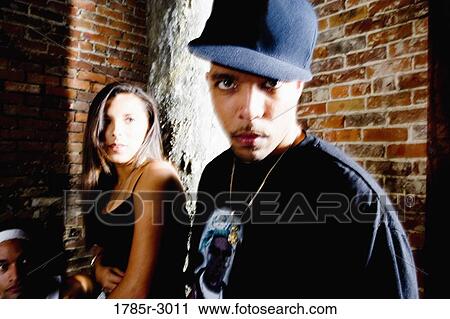Portrait of young couple in hip-hop fashion partying View Large Photo Image Stock Image - Portrait of young couple in hip-hop fashion partying. Fotosearch
