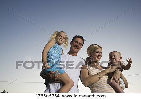Portrait of young family View Large Photo Image Picture - Portrait of young family. Fotosearch