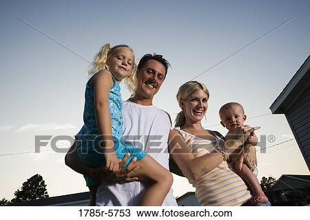 Stock Image - Portrait of young family. Fotosearch