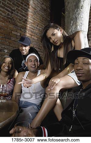 Portrait of young men and women partying and making gangsta gestures View Large Photo Image Stock Photo - Portrait of young men and women partying and making gangsta gestures. Fotosearch