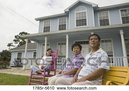 Pregnant woman and her parents seated in front lawn of house View Large Photo Image Stock Image - Pregnant woman and her parents seated in front lawn of house. Fotosearch