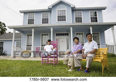 Pregnant woman and her parents seated in front lawn of house View Large Photo Image Stock Photo - Pregnant woman and her parents seated in front lawn of house. Fotosearch